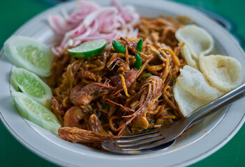 Delicious spicy Chinese noodles with shrimps at Indonesian street food market 