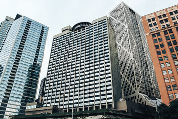 Naklejka premium Big buildings in the city on a clear sunny day, career growth