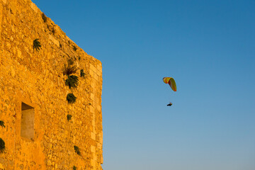 Fototapeta na wymiar Flying paraglider over Menorca island. Spain