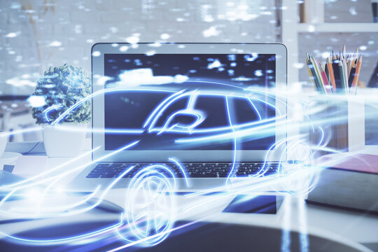 Desktop computer background in office with automobile hologram drawing. Multi exposure. Tech concept.