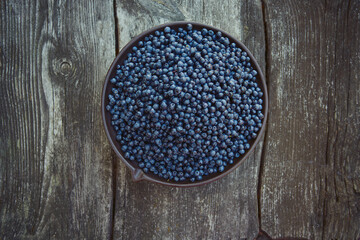 wild blueberries on rustic wooden surface