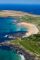 Aerial view of secluded bay along the rugged coastline of North Cornwall