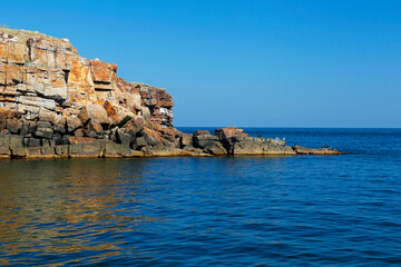 The rocky coast of the island of Serpents (Ukraine) on the high seas