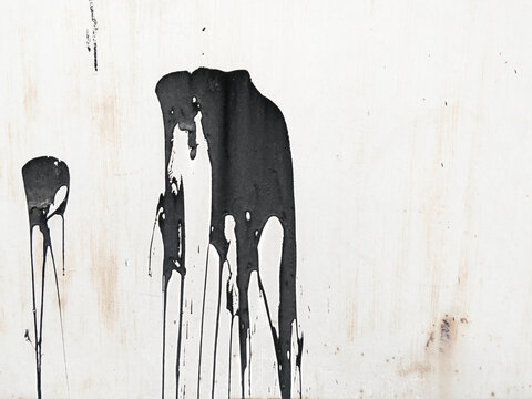 Paint Splash On Metal. Tar Painting Fragment. Paint splatter Art. Black Tar Spots on grunge and dirty grey metal background. Wall Painting
