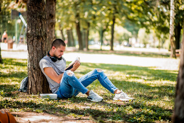 Man studying in the city park during the weekend