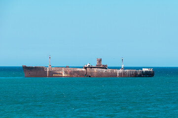 A shipwreck. An old wreck abandoned at sea. The wreck of the ship 