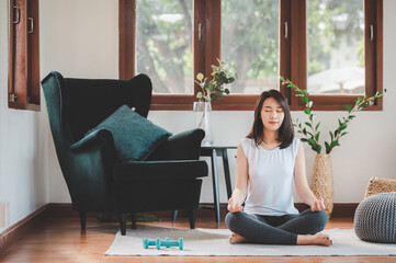Asian woman  practicing yoga meditation © interstid