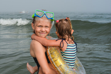Caucasian children outdoor in summer lifestyle on the beach
