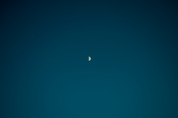 Half moon in clear sky.
