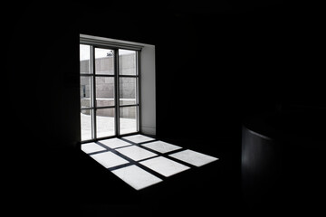 Sunlight creating a pattern through a window.