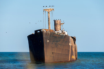 A shipwreck. An old wreck abandoned at sea. The wreck of the ship 