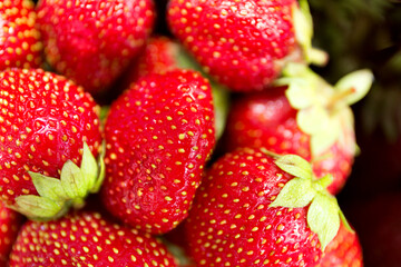 Fresh red srawberry close up background. Macro photo.
