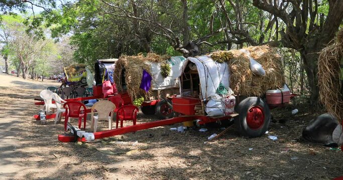 Nicaragua Indigent pilgrim native camp ox carts. Cultural traditions, diversity in folklore, cuisine and culture. Pilgrimage for faith and religion. Generally poor population in villages and cities.
