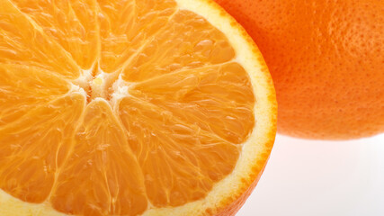 One orange fruit and half cut orange on white background