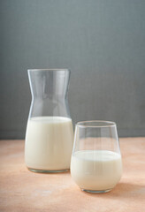 selective focus, dairy product in a glass container on a light table, milk, copyspace