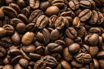 many coffee beans lie together on the table
