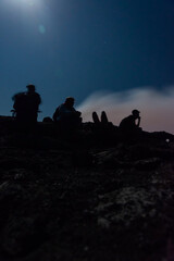 Silhouettes of people at Erta Ale volcano, Ethiopia