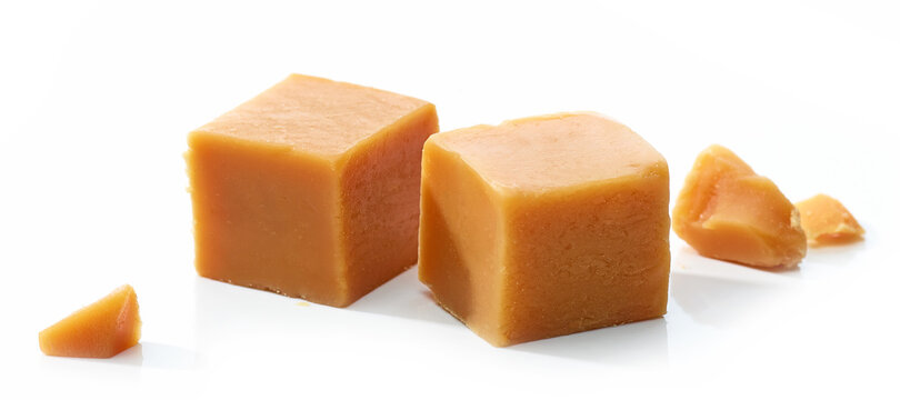 caramel candies on white background