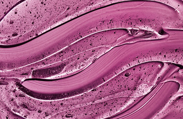 Cosmetic clear liquid transparent cream on purple background. Hyaluronic acid cosmetic gel.  Skin care product.