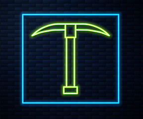 Glowing neon line Pickaxe icon isolated on brick wall background. Vector Illustration.