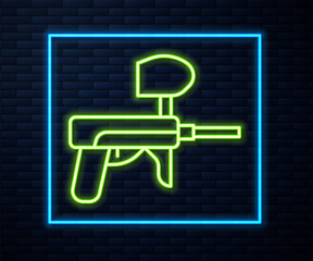 Glowing neon line Paintball gun icon isolated on brick wall background. Vector Illustration.