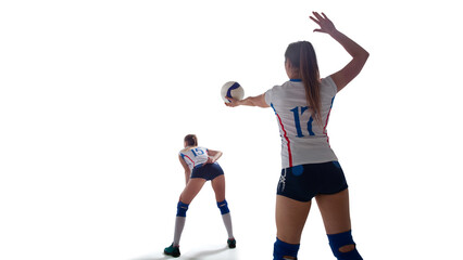 Female professional volleyball players in action on white background.