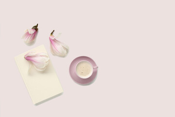 beautiful tender still life, card on a beige background, magnolia buds, a cup of cappuccino, concept of a floral spring background