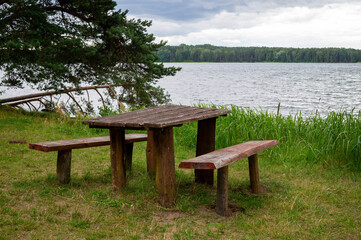 Empty rustic wooden table and chairs