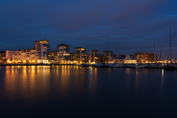 North harbour with luxury apartments in the coastal city Helsingborg during night-time.