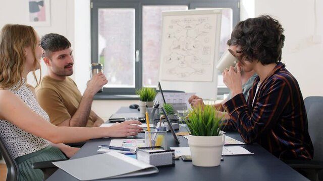 business, people and corporate concept - team of startuppers or ui designers working at office