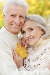 Portrait of beautiful senior couple embracing in the park