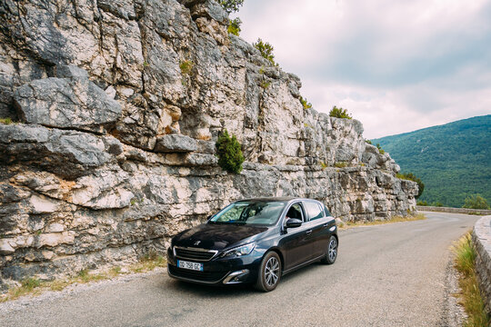 Black colour Peugeot 308 car on background of French mountain nature landscape the Gorges Du Verdon in France