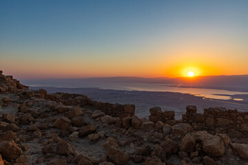 Dawn  over the mountains of Jordan and the Dead Sea. View from the territory of the ruins of the Massada fortress in Israel.