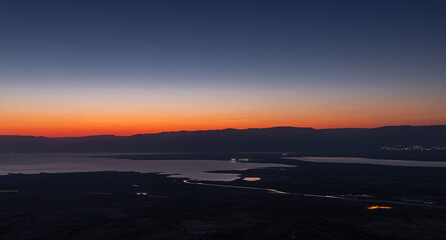 Dawn  over the mountains of Jordan and the Dead Sea. View from the territory of the ruins of the Massada fortress in Israel.