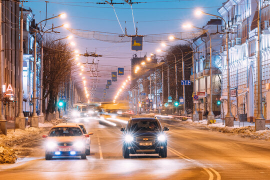 Gomel, Belarus. car and Chinese car Geely Emgrand EX7 standing together in Morning Traffic On Lenina Avenue Street At Sunrise