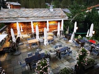 outdoor restaurant decorated with flowers