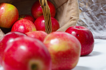 red ripe apples in a basket/ deep red color