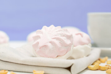 christmas concept. delicate marshmallow in light colors with a gray background. new year sweets