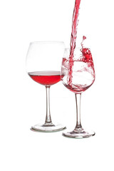pouring red wine in to wine glass.