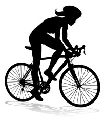 Bicyclist riding their bike and wearing a safety helmet in silhouette