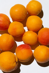 yellow bright color sweet summer apricot fruit  on a white vertical background