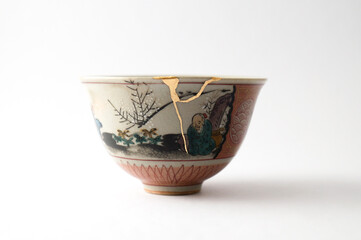 Japanese kintsugi ceramic chawan bowl restored with real gold. Antique pottery kintsukuroi.