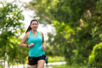 Healthy woman jogging run and workout on road outdoor. Asian runner people exercise gym 