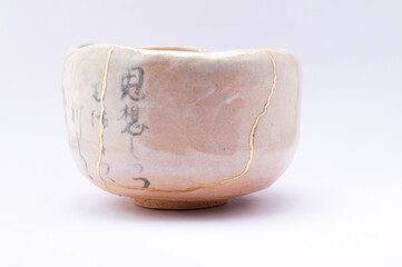 Japanese kintsugi ceramic chawan bowl restored with real gold. Antique pottery kintsukuroi.