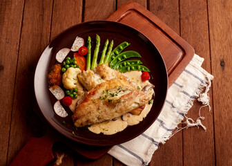 Fish dish, fried fish fillet and vegetables
