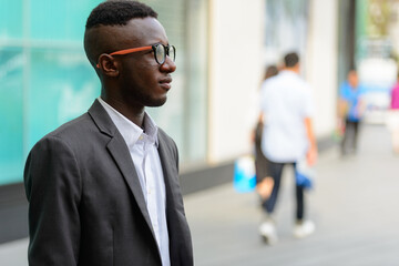 Young African businessman in the city outdoors