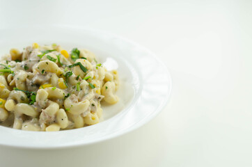 Cooked pasta with flaked tuna and sweetcorn in mayonnaise dressing
