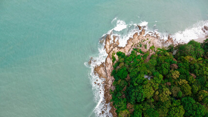 View from above, stunning aerial view of a beautiful beach bathed by a turquoise sea in summer....