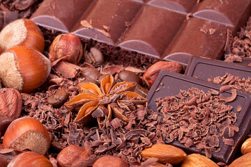 Tiles of different chocolate in the chocolate chips with nuts