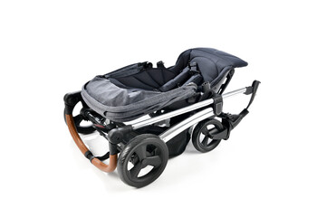 Folded baby stroller isolated on white background. 
